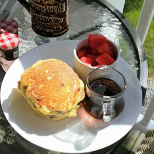 Pancakes, maple syrup and fruit salad