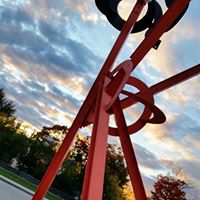 Metallic sculpture of Mark di Suvero's geometric sculpture Origins 